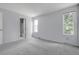 Light filled bedroom offering neutral walls and plush carpeting with easy access to the en-suite bathroom at 4580 W 109Th Ave, Westminster, CO 80031