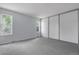Neutral bedroom with two windows allowing natural light and a large closet with white doors at 4580 W 109Th Ave, Westminster, CO 80031