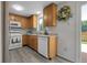 Well-lit kitchen boasting wood cabinets, a modern microwave, and access to the outdoor patio at 4580 W 109Th Ave, Westminster, CO 80031