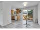 Bright and airy kitchen with a sliding glass door leading to the wooden deck and backyard at 4580 W 109Th Ave, Westminster, CO 80031