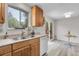 Bright kitchen with a stainless steel sink, dishwasher, and a sliding door that leads to a patio at 4580 W 109Th Ave, Westminster, CO 80031