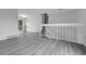 Bright open-concept living area with modern floors and easy access to outdoor space via sliding doors at 4580 W 109Th Ave, Westminster, CO 80031