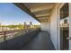 A balcony view with a gray railing, white doors, and a scenic cityscape backdrop at 1441 N Humboldt St # 504, Denver, CO 80218