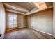 Spacious bedroom with exposed beams and a large window, offering ample natural light at 1441 N Humboldt St # 504, Denver, CO 80218
