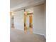 Hallway featuring multiple doorways leading to bathrooms and other rooms, enhancing accessibility at 1441 N Humboldt St # 504, Denver, CO 80218