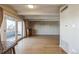 Bright living room featuring bamboo floors and a door leading to the balcony at 1441 N Humboldt St # 504, Denver, CO 80218