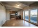 Open-concept living space with hardwood floors and kitchen access at 1441 N Humboldt St # 504, Denver, CO 80218