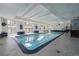 Bright community indoor swimming pool with ample seating and windows at 1441 N Humboldt St # 504, Denver, CO 80218