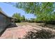 Large backyard with a concrete patio, ideal for gatherings and enjoying outdoor living at 971 Ursula St, Aurora, CO 80011