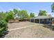 Large backyard offering ample space, with a shed and mature trees at 971 Ursula St, Aurora, CO 80011