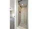 Tiled walk-in shower with modern fixtures in updated bathroom at 971 Ursula St, Aurora, CO 80011