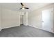 A carpeted bedroom with neutral walls and white trim, featuring a ceiling fan at 971 Ursula St, Aurora, CO 80011