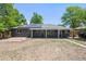 Charming single-story home with inviting front porch and solar panels for energy efficiency at 971 Ursula St, Aurora, CO 80011
