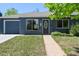 Charming single-story home with painted brick, attached garage, and well-maintained lawn at 971 Ursula St, Aurora, CO 80011