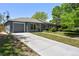 Charming single-story home with painted brick, attached garage, and well-maintained lawn at 971 Ursula St, Aurora, CO 80011
