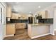 Bright kitchen with stainless steel appliances, granite countertops, and an island at 971 Ursula St, Aurora, CO 80011