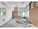 Bathroom under construction with exposed brick at 5030 Aspen Dr, Littleton, CO 80123