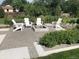 Modern fire pit and seating area in a landscaped backyard at 5030 Aspen Dr, Littleton, CO 80123