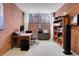 Spacious home office with wood desk and built-in shelving at 5030 Aspen Dr, Littleton, CO 80123