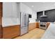 Modern kitchen with stainless steel appliances and marble counters at 5030 Aspen Dr, Littleton, CO 80123