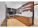 Modern kitchen with wood cabinets and marble counters at 5030 Aspen Dr, Littleton, CO 80123