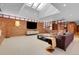 Sunken living room with brick walls and large windows at 5030 Aspen Dr, Littleton, CO 80123