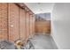 Storage room with shelving and brick walls at 5030 Aspen Dr, Littleton, CO 80123