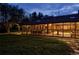 Sunroom at night, view from backyard at 5030 Aspen Dr, Littleton, CO 80123