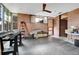 Workshop area with concrete floor and ceiling fan at 5030 Aspen Dr, Littleton, CO 80123