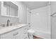 Clean bathroom, featuring a white vanity and subway tile at 6643 W 96Th Ave, Broomfield, CO 80021