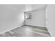 Spacious bedroom with grey wood-look floors and a window at 6643 W 96Th Ave, Broomfield, CO 80021