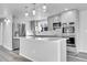 Modern kitchen with stainless steel appliances and white quartz countertops at 6643 W 96Th Ave, Broomfield, CO 80021