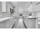 Modern kitchen with stainless steel appliances and white quartz countertops at 6643 W 96Th Ave, Broomfield, CO 80021