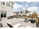 Multi-level backyard featuring a deck, a patio with a fire pit, and outdoor seating for relaxing and entertaining at 10106 E 59Th Pl, Denver, CO 80238