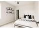 This bedroom is bright and features dark accents, carpet, and is well lit at 10106 E 59Th Pl, Denver, CO 80238