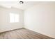 An unfurnished bedroom offering a blank canvas with its wooden floor and natural light at 10106 E 59Th Pl, Denver, CO 80238