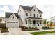 Beautiful two-story home with a covered front porch and a convenient two-car garage at 10106 E 59Th Pl, Denver, CO 80238