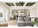 Open-concept living area with seamless access to the kitchen and outdoor patio at 10106 E 59Th Pl, Denver, CO 80238