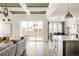 Bright living room with a view of the dining area, kitchen and the outdoor patio at 10106 E 59Th Pl, Denver, CO 80238
