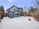 Large backyard with pergola and snowy landscape at 3100 Rockbridge Dr, Highlands Ranch, CO 80129