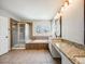 Large bathroom with soaking tub, shower, and double vanity at 3100 Rockbridge Dr, Highlands Ranch, CO 80129