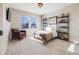 Bedroom with a bed, chair, and built-in shelving at 3100 Rockbridge Dr, Highlands Ranch, CO 80129