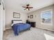 Bedroom with a queen bed, desk and carpeted flooring at 3100 Rockbridge Dr, Highlands Ranch, CO 80129