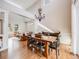 Bright dining room with a rustic wooden table and chandelier at 3100 Rockbridge Dr, Highlands Ranch, CO 80129