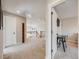 Upstairs hallway with carpet, a desk area and views to the main floor at 3100 Rockbridge Dr, Highlands Ranch, CO 80129