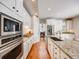 Modern kitchen with stainless steel appliances, granite countertops, and white cabinets at 3100 Rockbridge Dr, Highlands Ranch, CO 80129