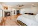 Main bedroom with fireplace, en-suite bathroom, and TV at 3100 Rockbridge Dr, Highlands Ranch, CO 80129