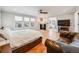 Main bedroom with fireplace, en-suite bathroom, and seating area at 3100 Rockbridge Dr, Highlands Ranch, CO 80129