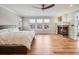 Main bedroom with fireplace and en-suite bathroom at 3100 Rockbridge Dr, Highlands Ranch, CO 80129