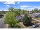 Aerial shot of a quiet residential street with well-maintained homes and green landscaping at 1089 S Osceola St, Denver, CO 80219
